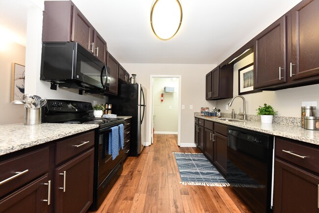 Kitchen with granite counters and modern cabinetry