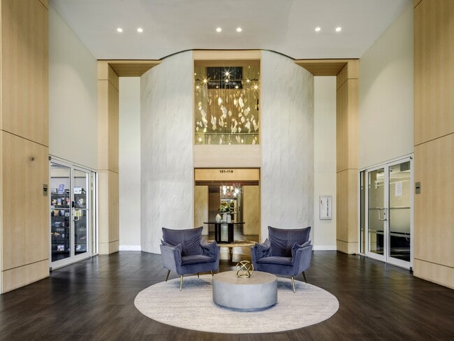 Lobby seating sits under a ceiling that goes up two full floors here.