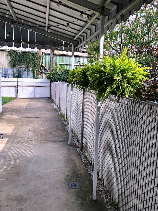 Private Parking is a game changer in the city. Covered side porch fits a 2pp love seat creating an inviting covered patio area. - 4908 Hatfield Street