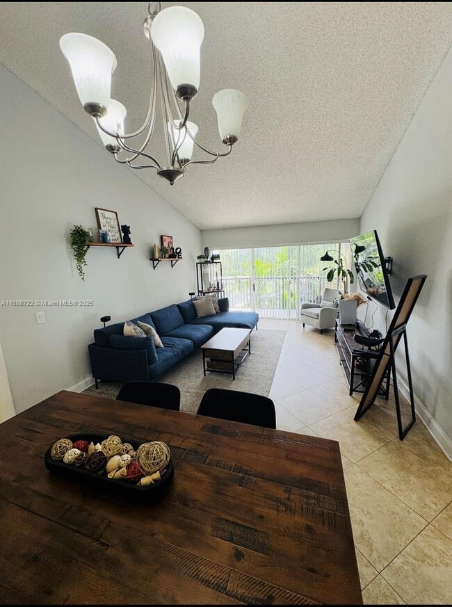 Building Photo - 8821 Wiles Rd Unit 305