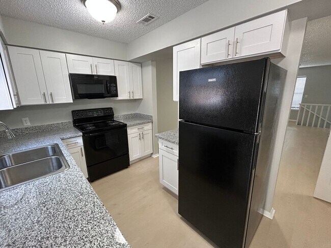 Photo - 1/2 OFF 1ST MONTH RENT! Modern 3-Bed, 2.5-Bath Townhome with Granite Kitchen & New Appliances!