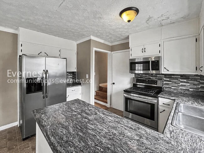 Photo - 3 Bed, 2 Bath Home with Carport / Pet-Friendly / Coming Soon!