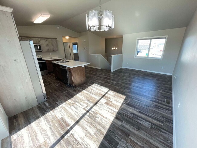 Photo - Spacious 4-Bed, 2-Bath Split-Level Townhome with Attached Heated Garage