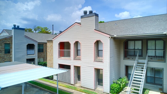 Side frontal view, seen from the Southeast. The front door, balcony and door to the storage room is