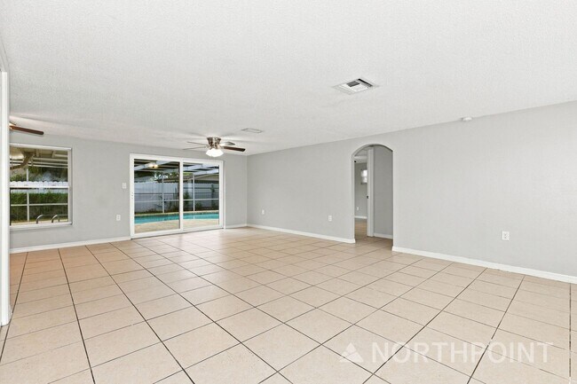 Photo - 3-Bedroom, 2 Bath Single Home for Rent in Port Richey, FL | Attached Garage & Private Pool!