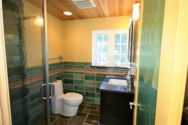 Bathroom with corner shower, cedar ceiling - 69 S Shannon Ave Unit Studio
