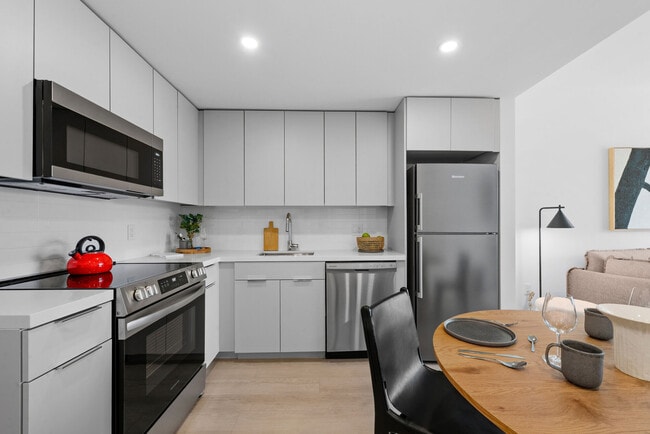 Kitchen with Stainless-Steel Appliances - CMPND Miami