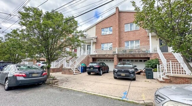Building Photo - 161 W 53rd St Unit 1 and Basement Rental