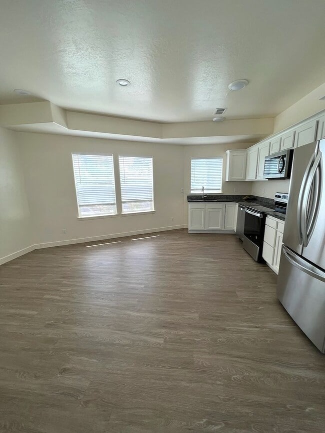 Photo - Hurry—Deposit Moves You In! | Modern 3-Bedroom Townhome with a 2-Car Garage & Private Balcony in ...