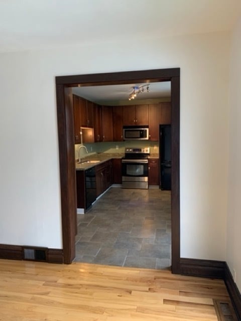 view of kitchen from formal dining room - 1818 E 7th St