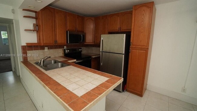 Building Photo - 1150 NW 30th Ct Unit 203
