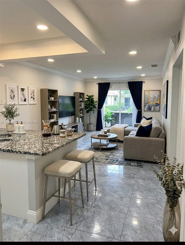 Building Photo - 1075 W 68th St Unit 218