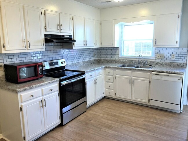 Photo - SW Large Brick Home, Updated Kitchen & Bathrooms, Wood Like Flooring, Fenced Yard!