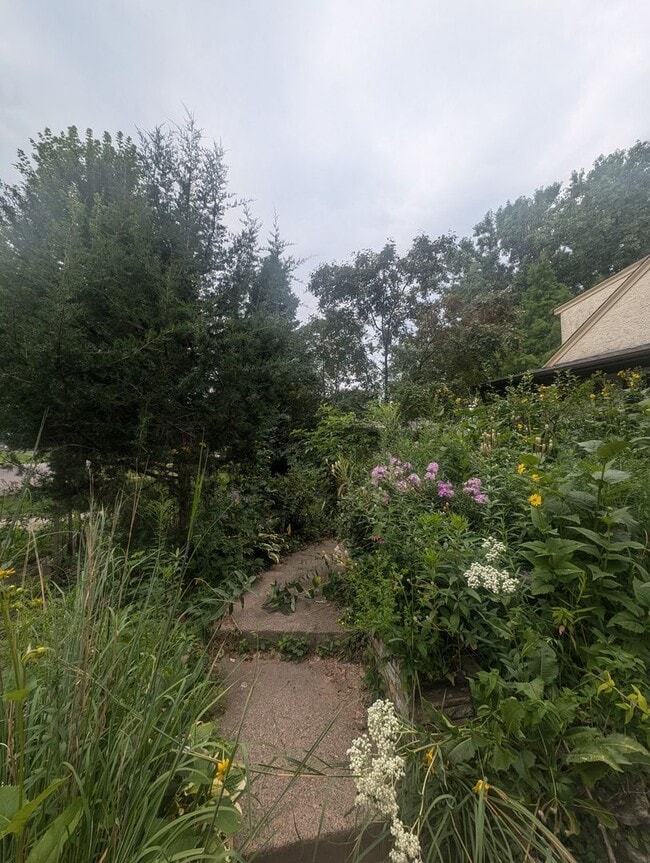 Photo - Charming Garden Oasis in West St. Paul – Fire Pit, Pond & Prime Location!