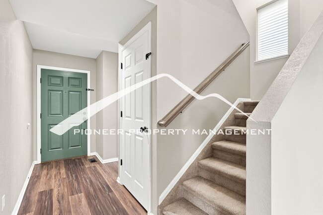 Photo - Spacious 4-Bedroom Home with a Finished Basement, 2 car garage, EV Charger and Low Maintenance, E...