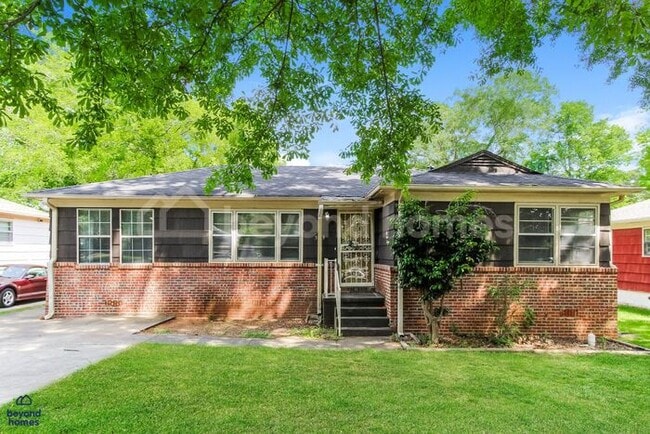 Building Photo - Updated Bungalow with Massive Deck and Fully Fenced Yard!