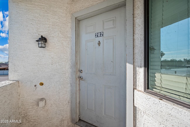 Building Photo - 3065 N 67th Ave Unit 202