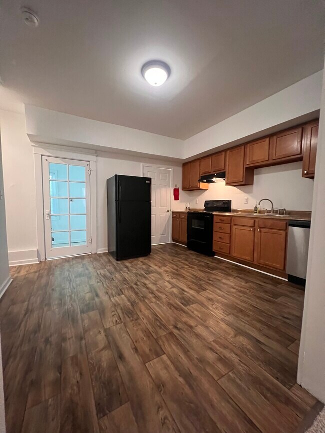 Kitchen. Brand new flooring - 7016 Minnesota Ave Unit Minnesota Avenue 63111