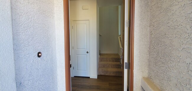 Photo - Contemporary townhome with modern exterior and attached garage.