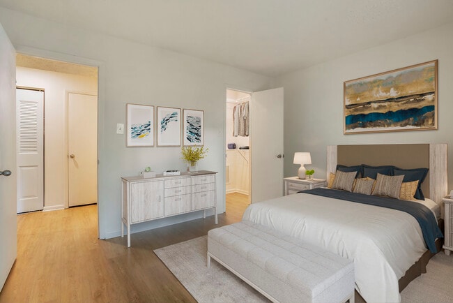 Upgraded Package II bedroom with hard surface flooring and walk-in closet