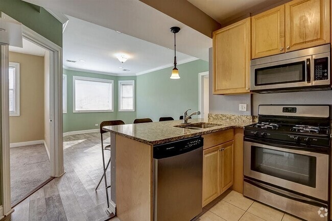 Building Photo - 4966 N Spaulding Ave Unit #G Rental