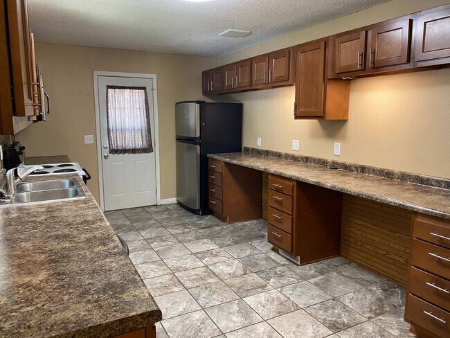 Photo - Spacious 4-Bedroom Home with Garage and Backyard in Milan!