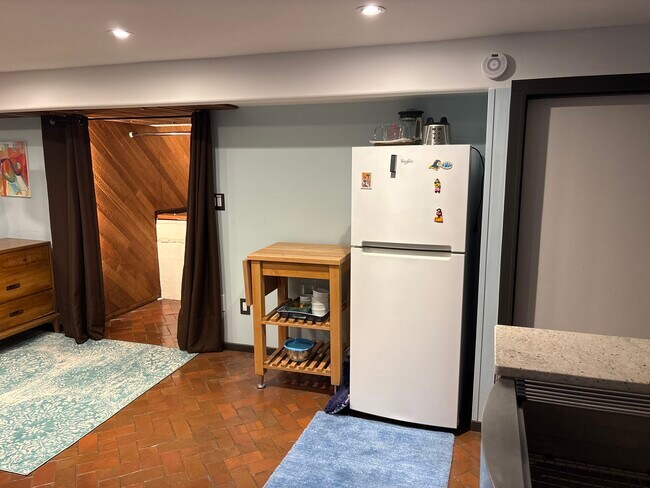 Closet has additional storage cubby behind clorhing - 4312 37th Ave NE