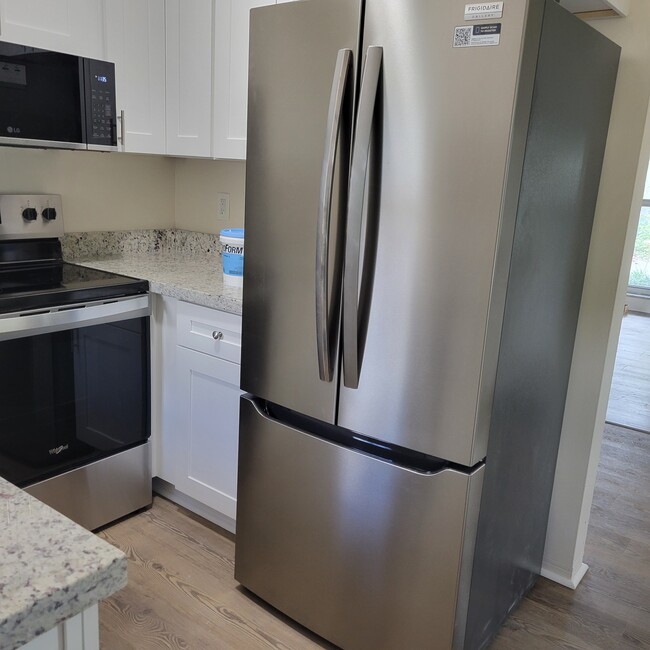 new stainless steel refrigerator - 2031 NE 56th St Unit 1