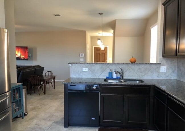 Photo - "Spacious 4-Bedroom Retreat with Granite Countertops & Private Movie Room in Selma, TX!"