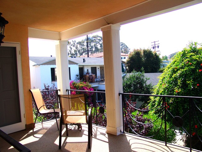 Patio overlooking lush garden - 817 6th St Condo Unit E