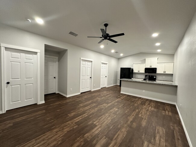 Open Living + Kitchen Area - 107 S Bois D Arc St Townhome