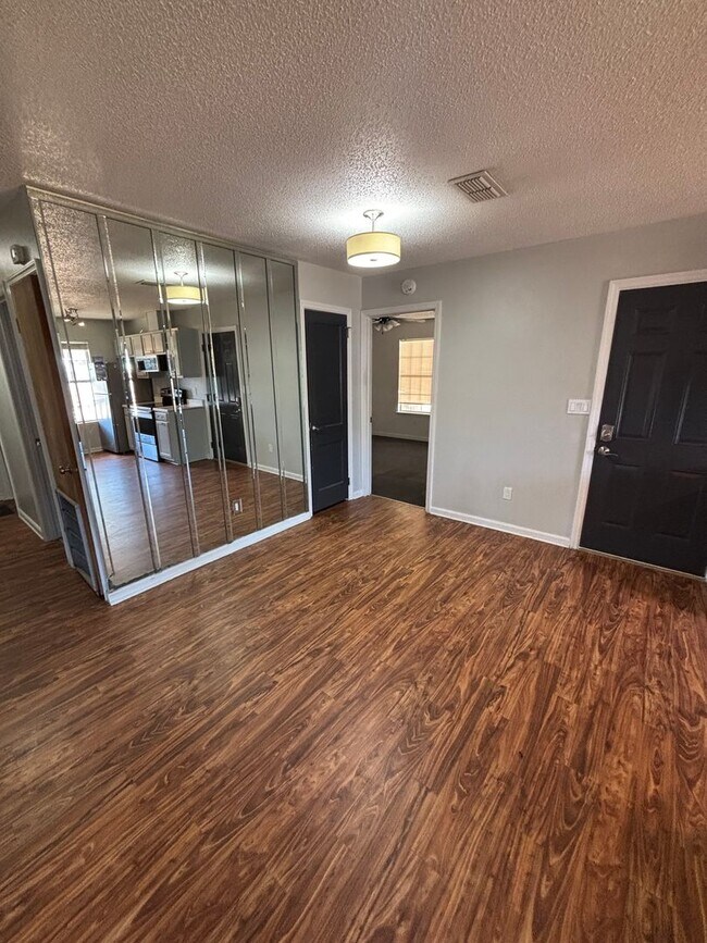 Photo - Spacious 4-Bed, 2-Bath Home with Yard and ...