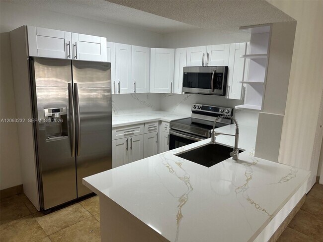 Photo - 9491 Palm Cir S Unit 203
