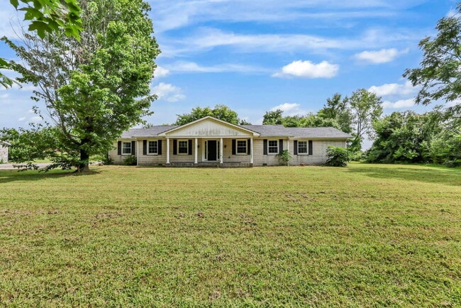 Photo - spacious 4-bedroom, 2.5-bath home featuring a 2-car garage and fresh updates throughout.
