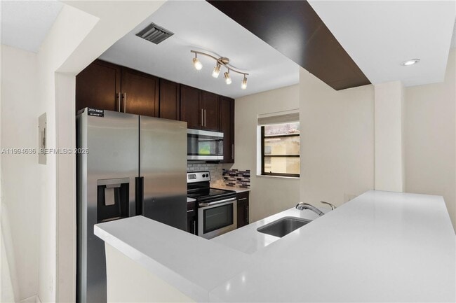 Building Photo - 6316 SW 136th Ct Unit 209G