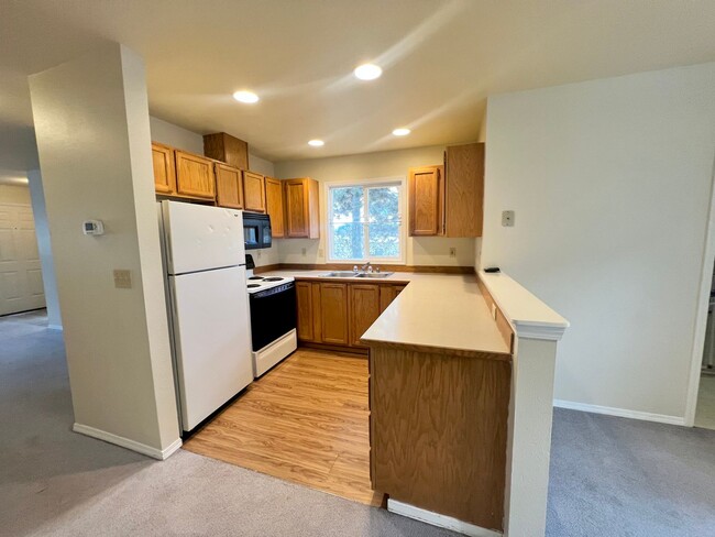 Photo - Corner Condo Unit with Private 1-Car Garage