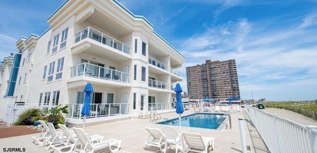 Building Photo - 9220 Atlantic Ave Unit 203