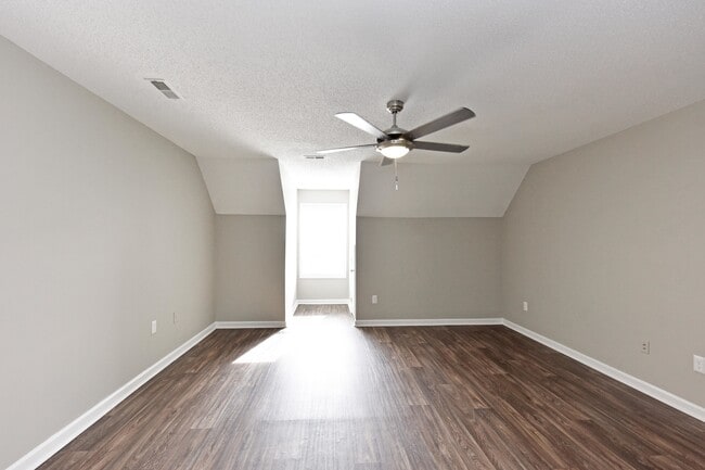 Spacious living room with hardwood-style flooring