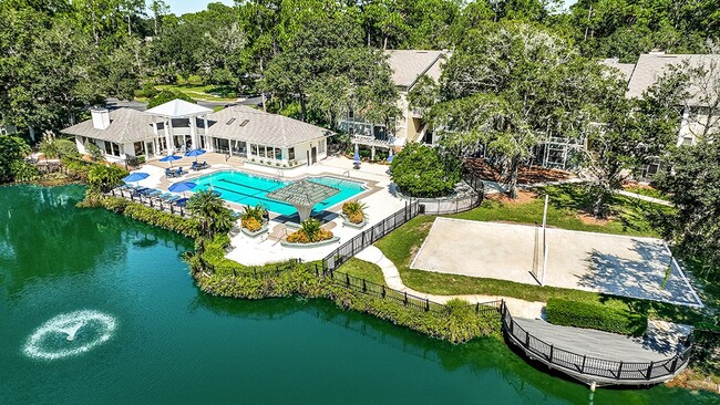 Resort Style Pool and Sand Volleyball Overlooking Lake - The Waterford at Mandarin Apartments