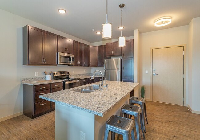 Gorgeous Granite Counter Tops & Kitchen Island with Brown Cabinets, BD1, 1BA - 821 SF
