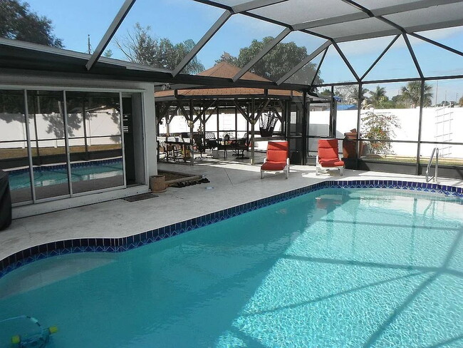 Building Photo - 4-Bedroom Pool Home with 2 Full Baths - Spacious 2373 Sq Ft Home in Englewood's Prime Location!"