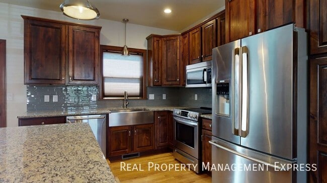 Photo - Beautiful 4 Bed 3.5 Bath House with 3-stall attached garage and fenced backyard on West side