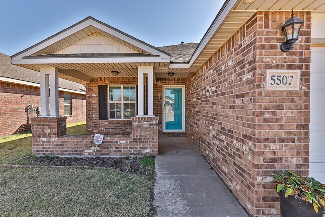 Photo - Relax on this front porch!