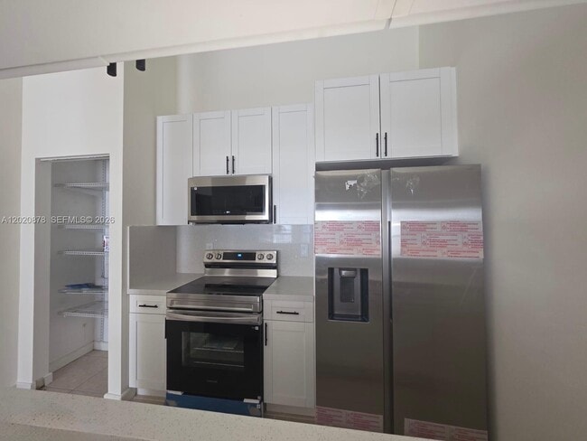 Building Photo - 18310 Mediterranean Blvd Unit 8-24