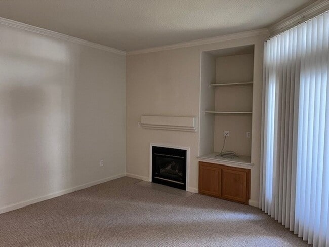 Photo - Gated condo with 1 car garage and community pool.