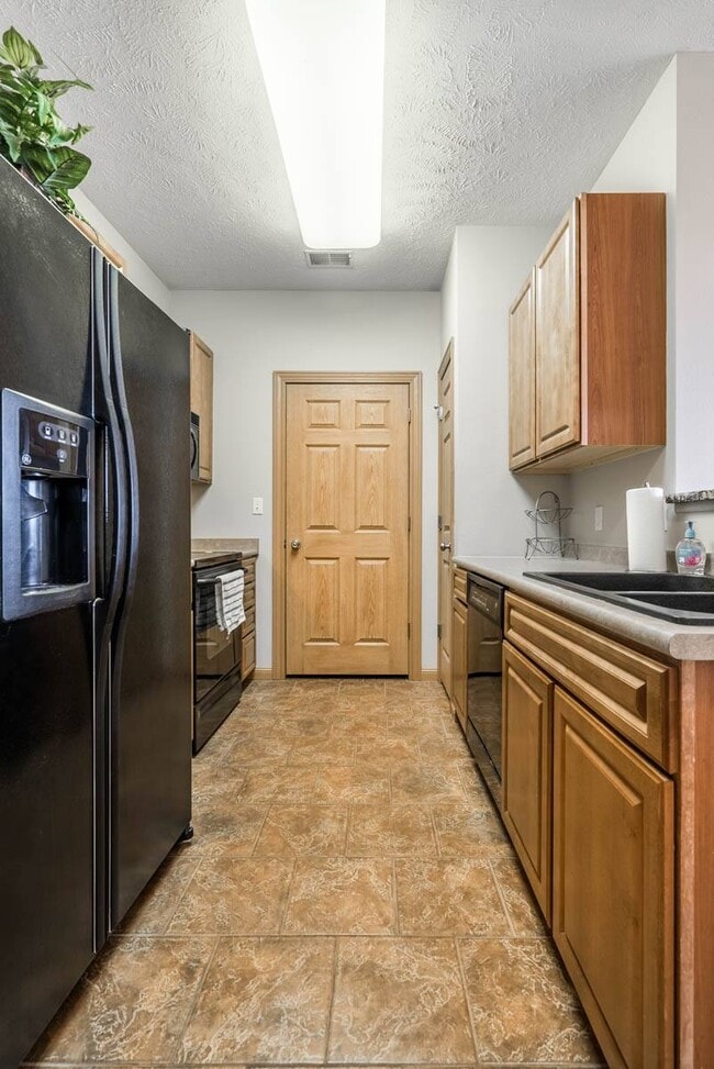 Our kitchens make meal prep a breeze, with easy access to all appliances and ample storage space to keep everything organized. - Stone Ridge Estates Apartments & Duplexes