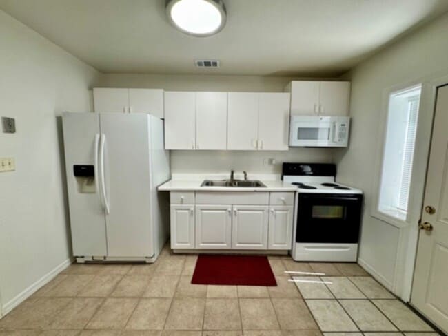 Photo - 4 Bedroom, 2 Bath House with Huge Fenced Yard, ALL Tile Floors!