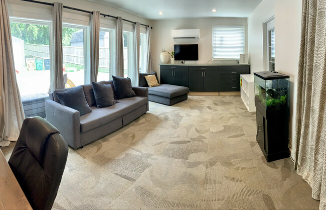 Bonus room featuring a wall of Pella windows - 604 Joyce Ln Casa