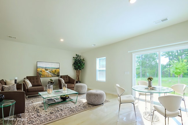 Living area. Photo virtually staged. - 1510 Alvin Pond Dr Rental
