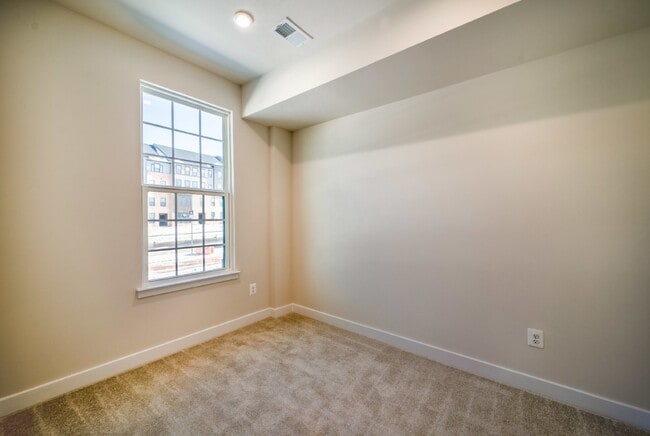 Photo - This 3-bedroom, 3-full bathroom townhouse offers a pristine and contemporary living experience.